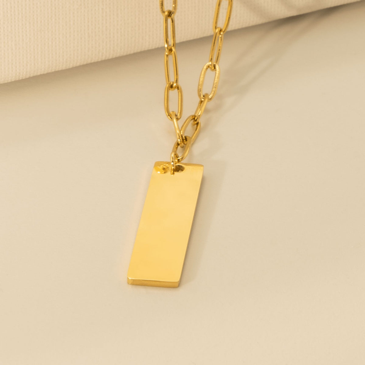 Collier trombone barre verticale